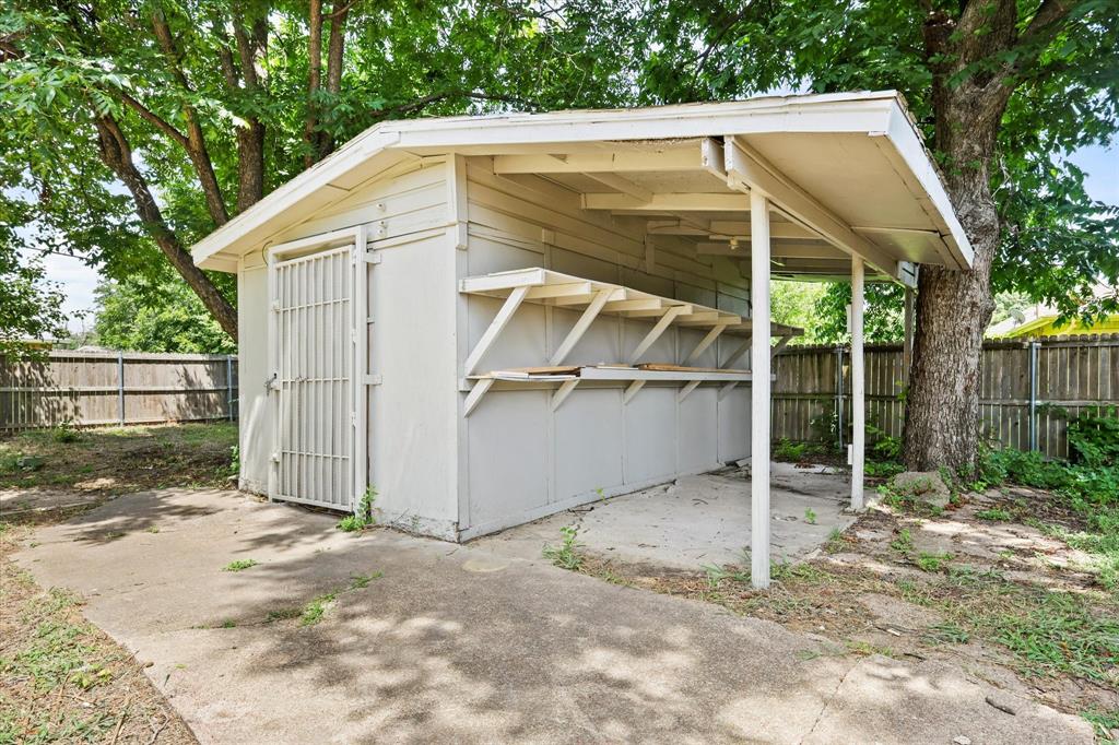 5629 Maceo Lane Fort Worth, TX 76112 - Photo 24 of 25 a view of small white house with a small yard and large tree