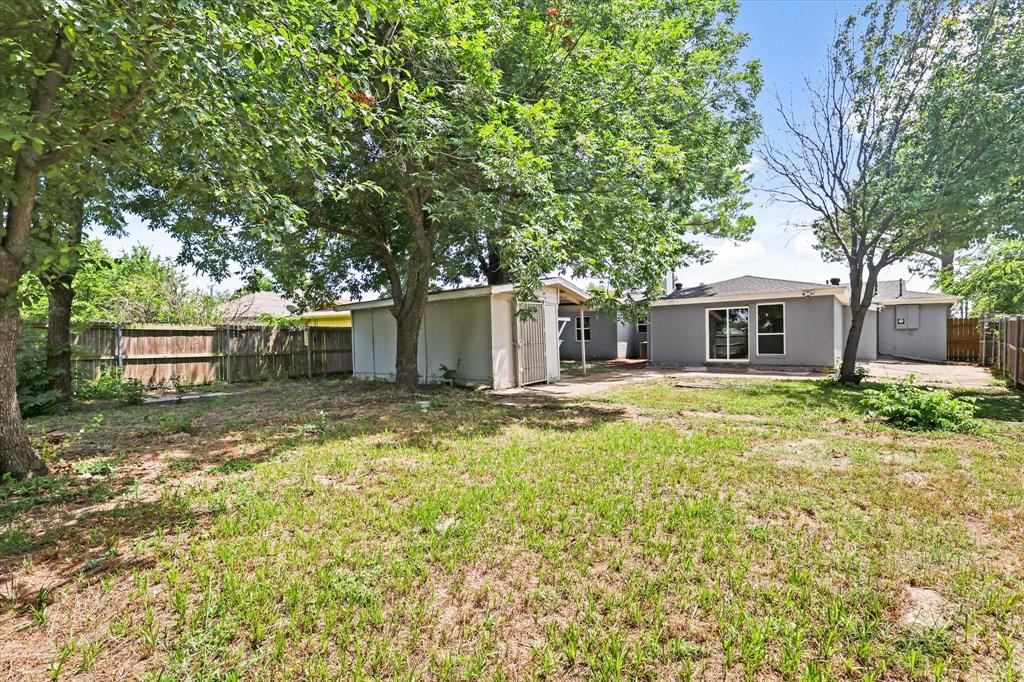 5629 Maceo Lane Fort Worth, TX 76112 - Photo 25 of 25 a front view of a house with a garden