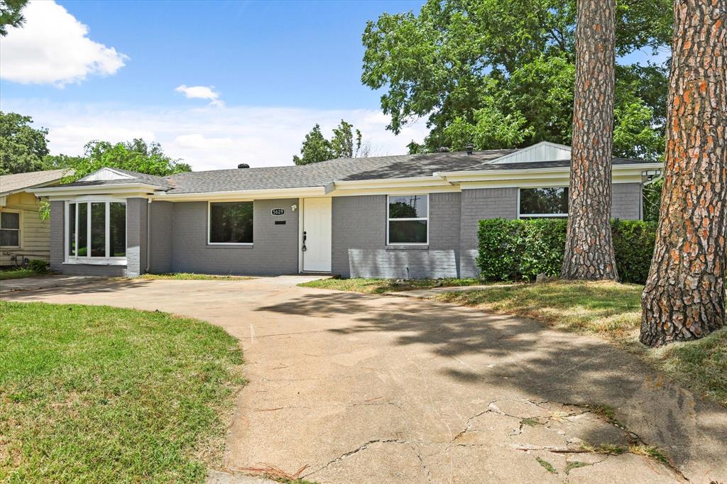 5629 Maceo Lane Fort Worth, TX 76112 - Photo 3 of 25 a view of a house with a yard and potted plants