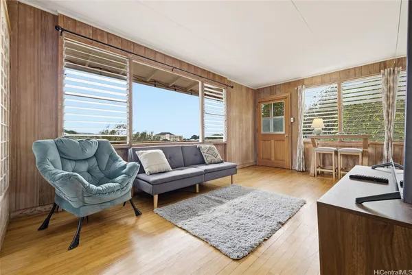 a living room with furniture and a table