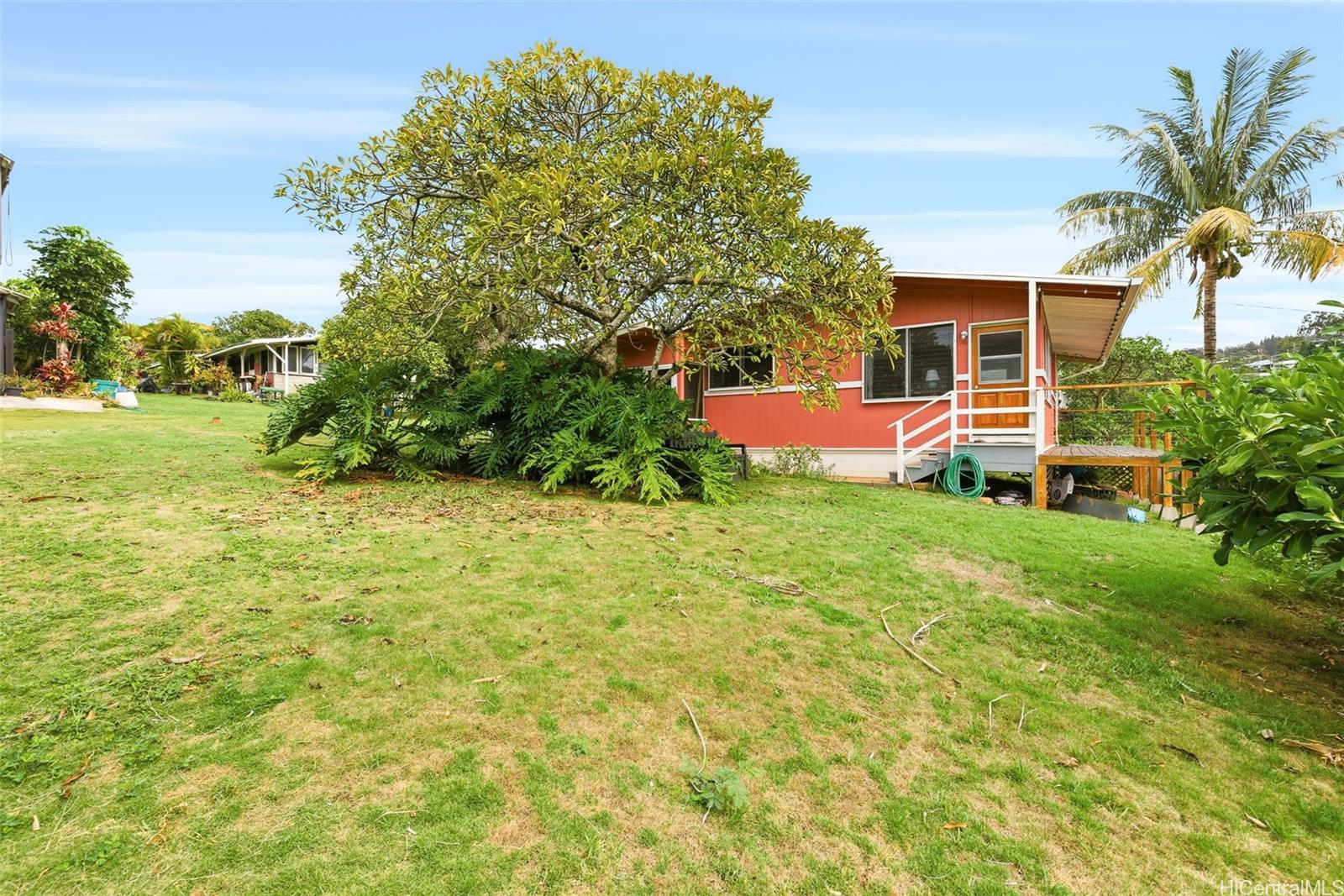 99-139 B Napuanani Road, Unit 3 Aiea, HI 96701 - Photo 11 of 12 a view of a backyard with plants and large trees