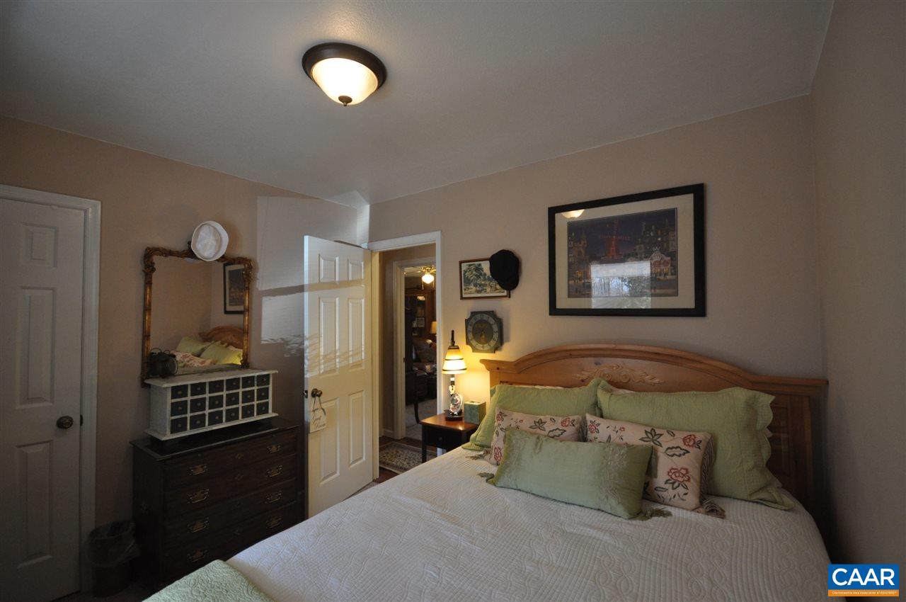 27 Stonewall Road Palmyra, VA 22963 - Photo 8 of 13 a bedroom with a bed and wooden floor