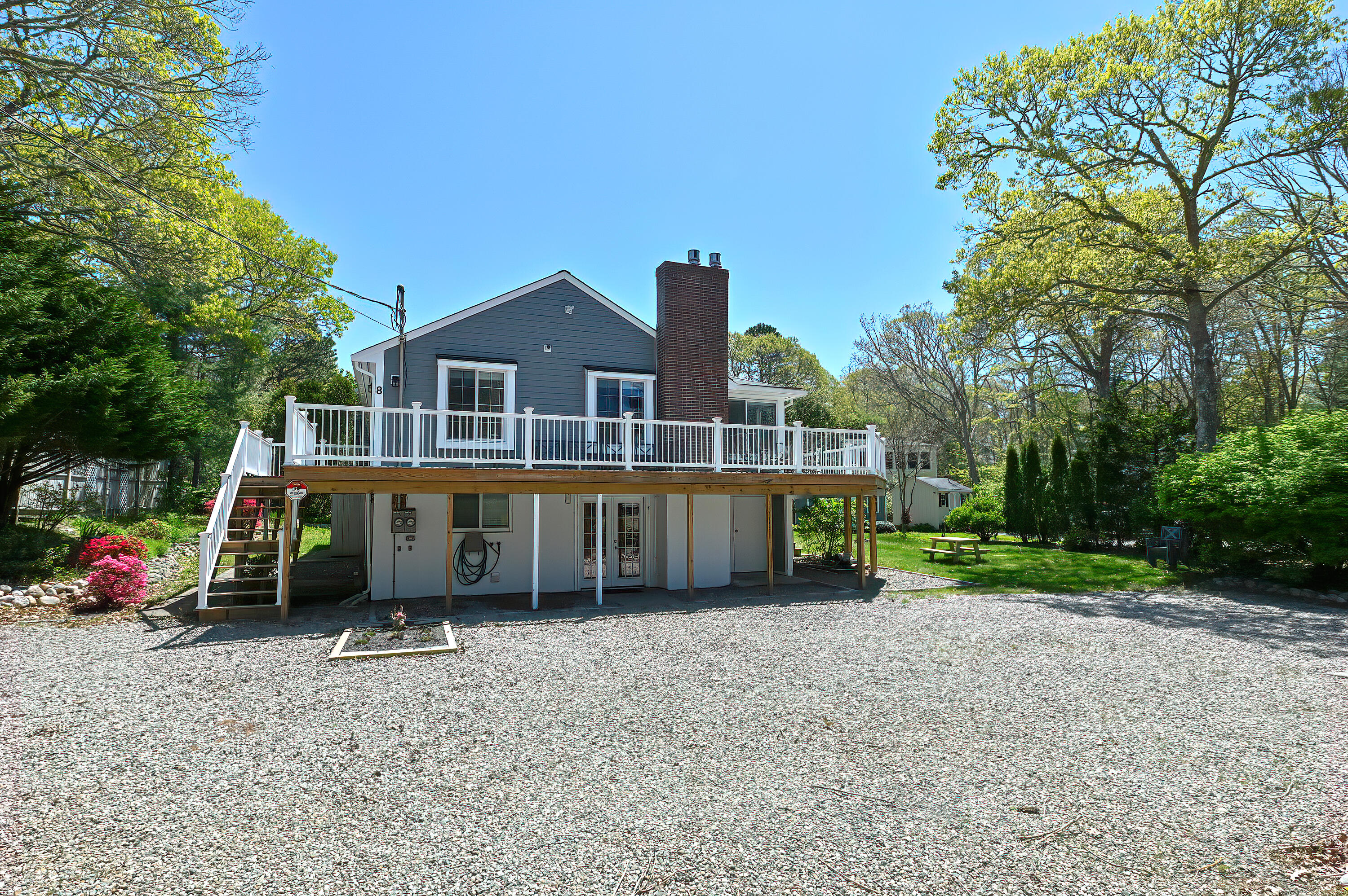 8 Cutlass Lane Mashpee, MA 02649 - Photo 70 of 93 a view of a house with a yard and sitting area
