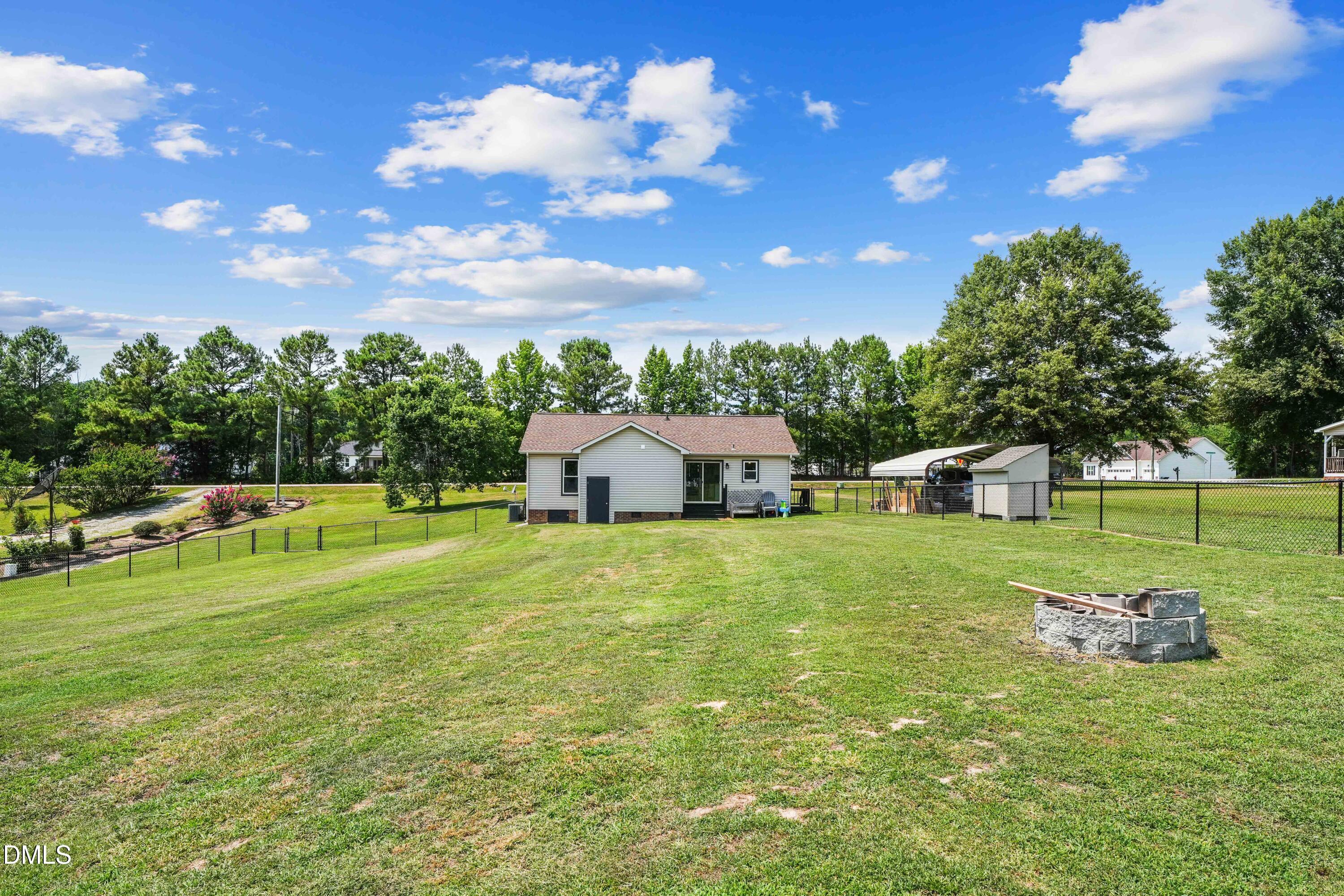 101 Stephenson Road Benson, NC 27504 - Photo 24 of 29 a front view of a house with garden