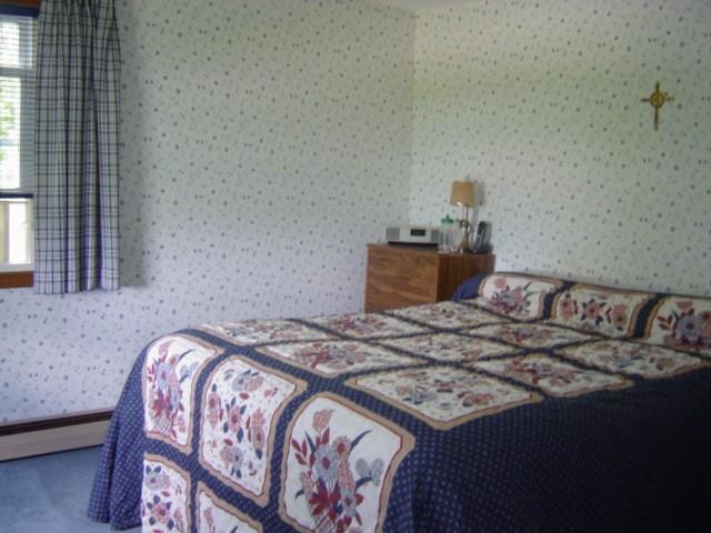 395 Crockett Ridge Road Norway, ME 04268 - Photo 10 of 24 The master bedroom is located on the...