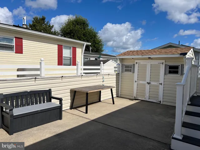 a view of a room with table and chairs
