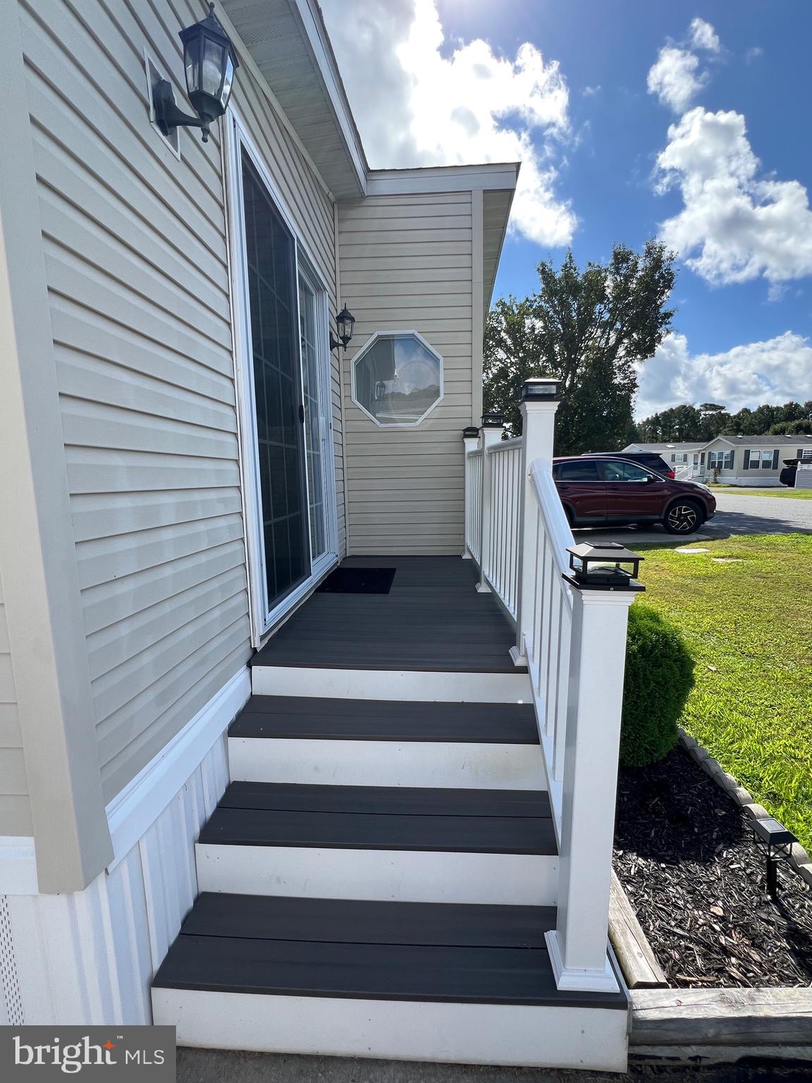 8339 Longboat Way South Berlin, MD 21811 - Photo 13 of 92 Front Slider with Composite Steps, Vinyl Railing