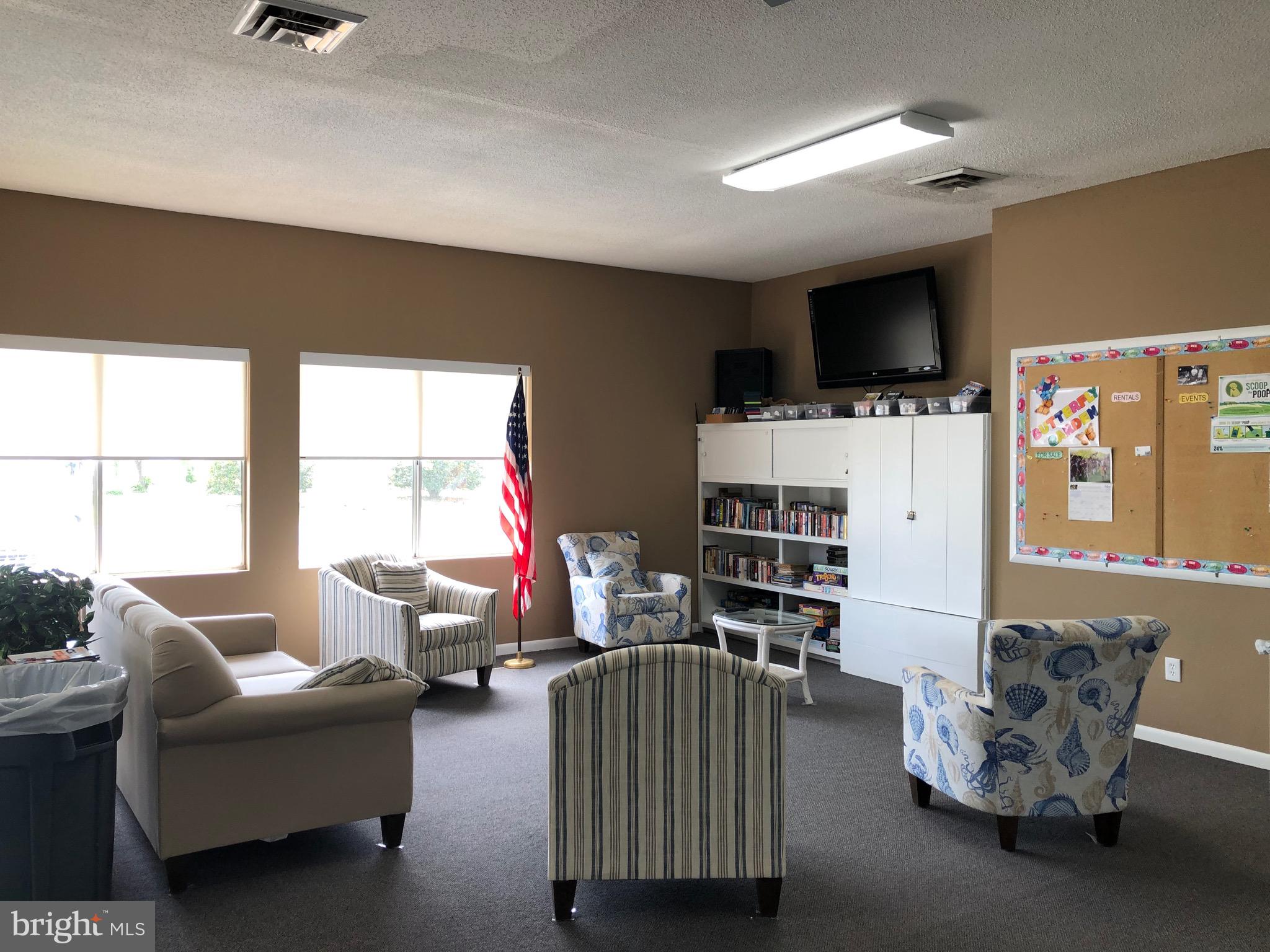 8339 Longboat Way South Berlin, MD 21811 - Photo 37 of 92 a living room with furniture and a flat screen tv