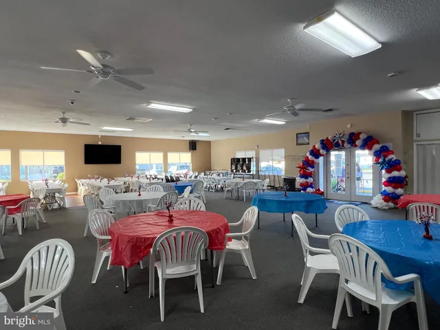 a view of a street with a bench and trees