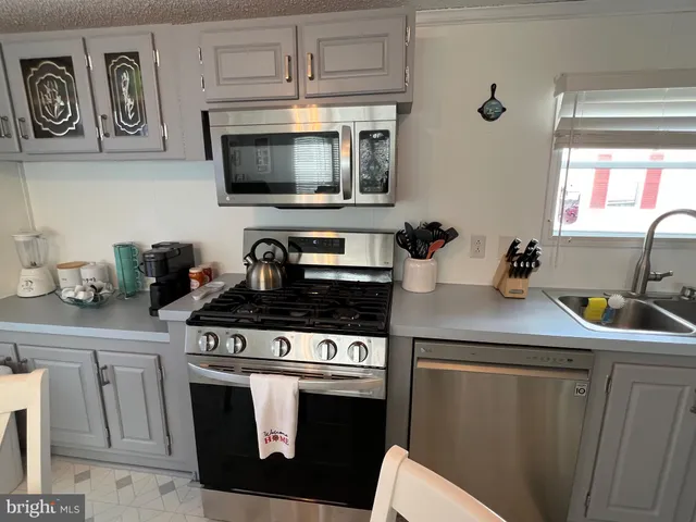 a view of a bedroom and a flat tv screen