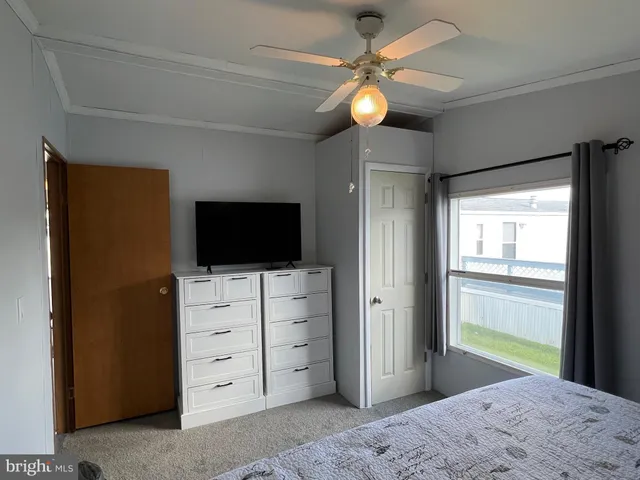 a bathroom with a shower sink and mirror