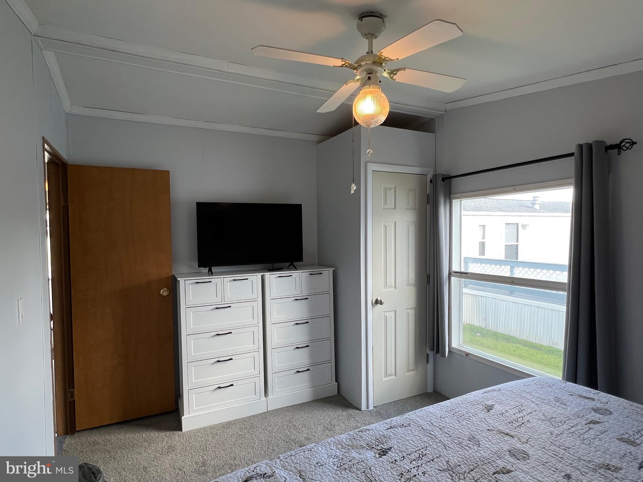 8339 Longboat Way South Berlin, MD 21811 - Photo 7 of 92 a view of a bedroom and a flat tv screen