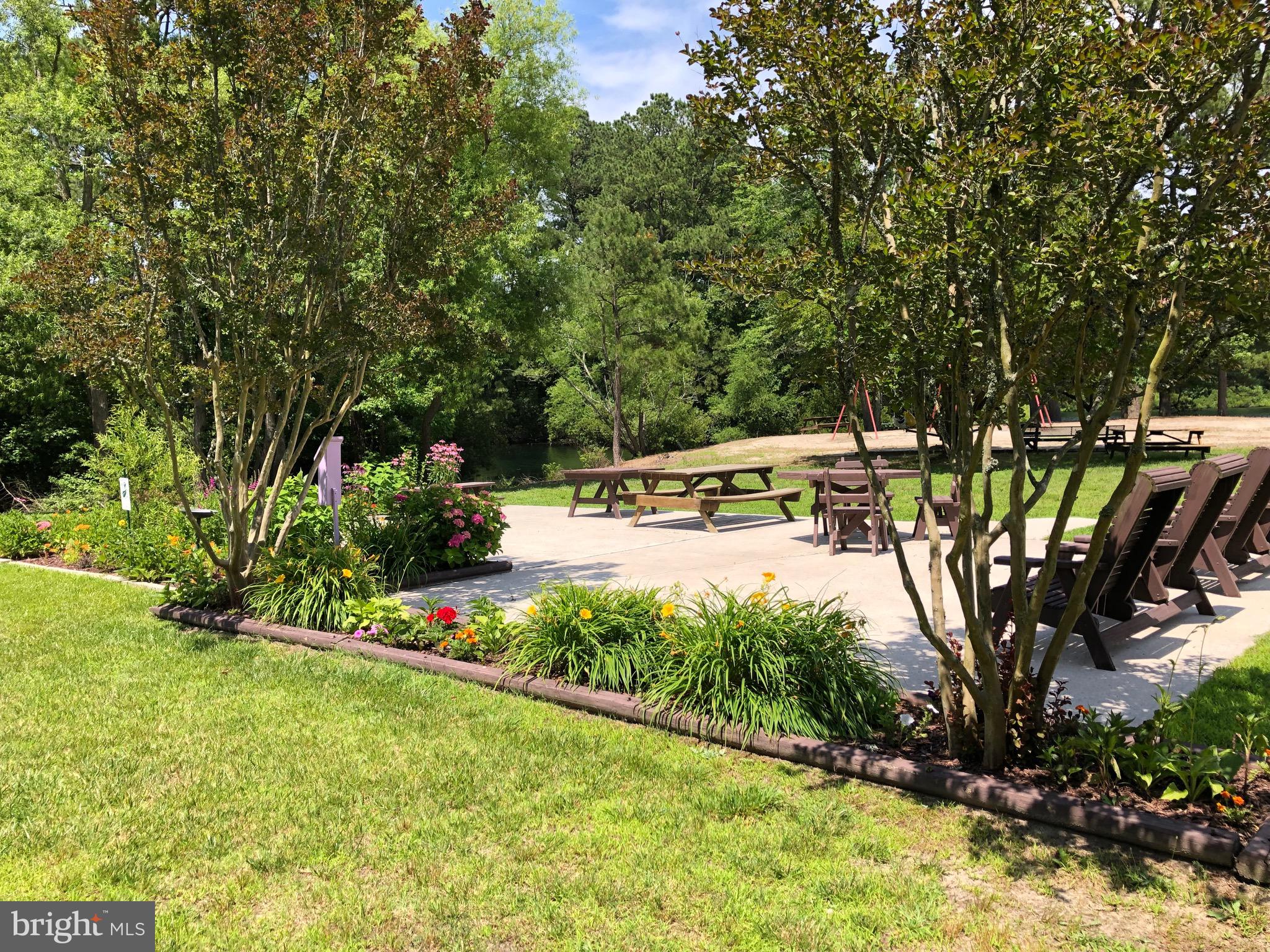 8339 Longboat Way South Berlin, MD 21811 - Photo 74 of 92 a view of a swimming pool with a patio
