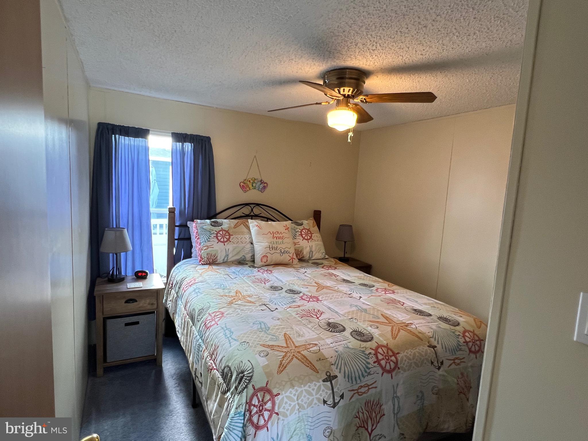 8339 Longboat Way South Berlin, MD 21811 - Photo 8 of 92 a bedroom with a bed and a chandelier