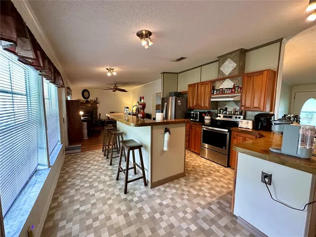 a living room with furniture a clock and a fireplace