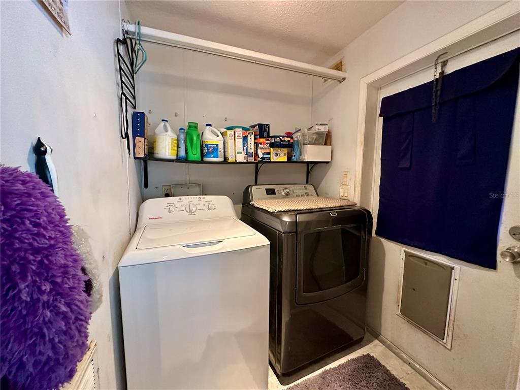 56233 Water Oak Road Astor, FL 32102 - Photo 21 of 50 a utility room with dryer and washer