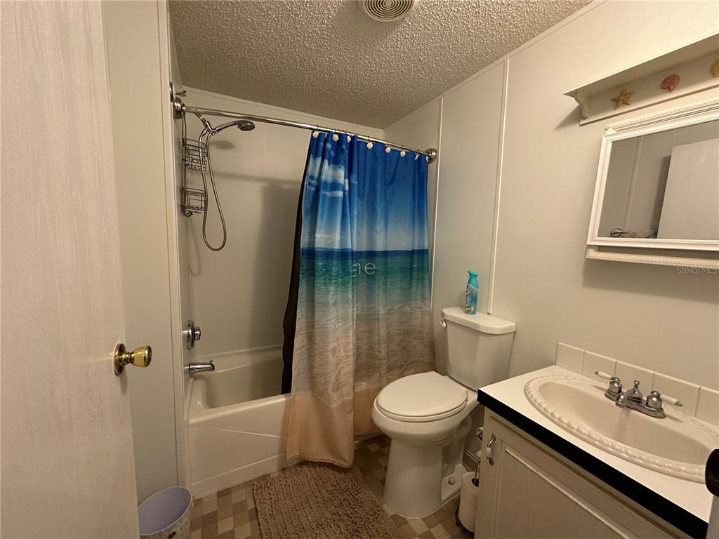 56233 Water Oak Road Astor, FL 32102 - Photo 23 of 50 a bathroom with a sink toilet and shower