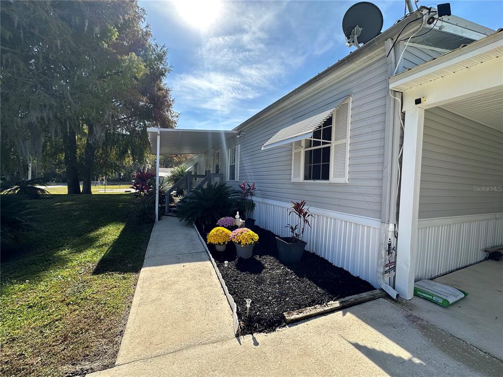 56233 Water Oak Road Astor, FL 32102 - Photo 38 of 50 a front view of a house with a yard
