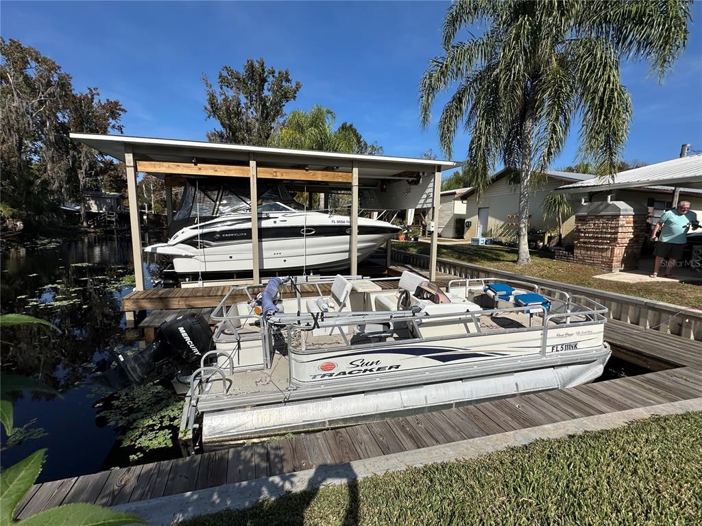 56233 Water Oak Road Astor, FL 32102 - Photo 42 of 50 a view of house with outdoor seating space