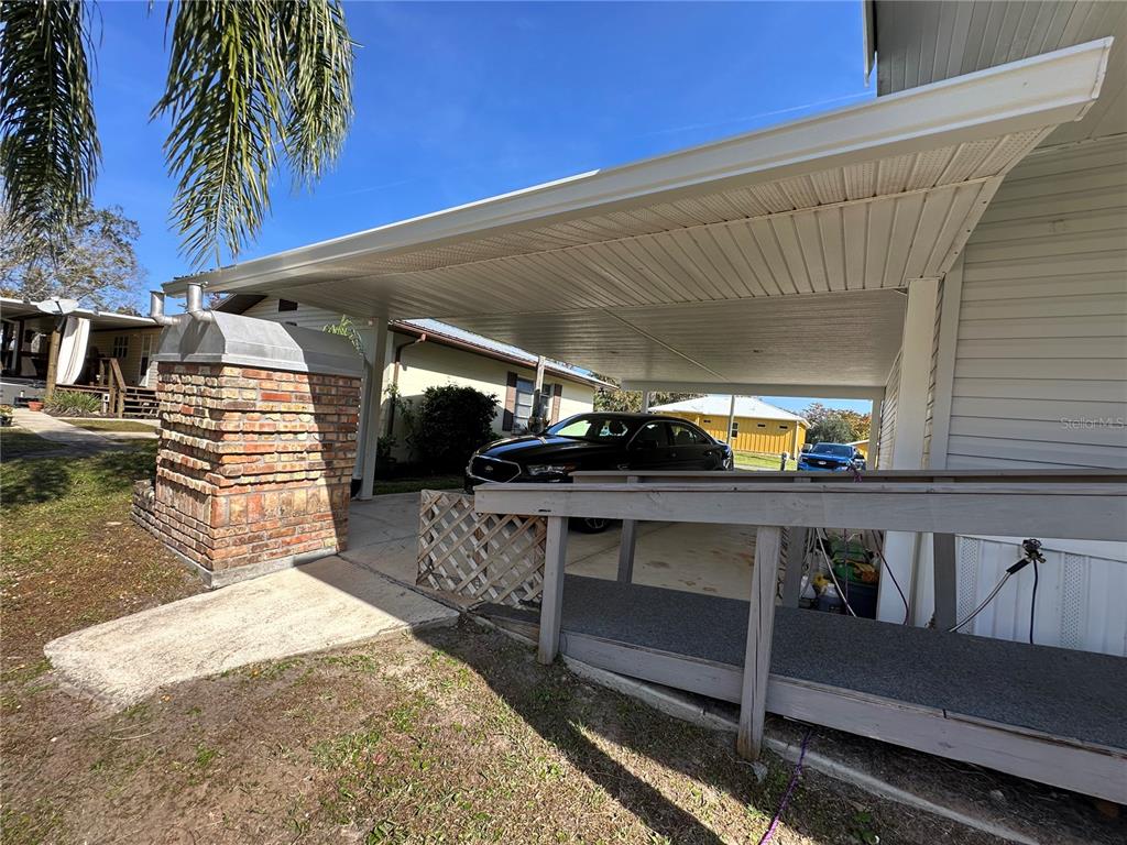 56233 Water Oak Road Astor, FL 32102 - Photo 50 of 50 a view of a balcony with furniture and a potted plant