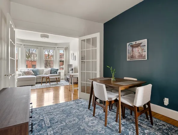 a room with wooden floor and furniture