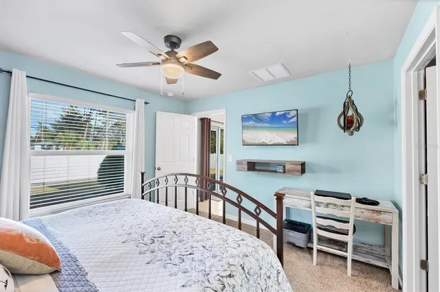a bedroom with furniture and a window