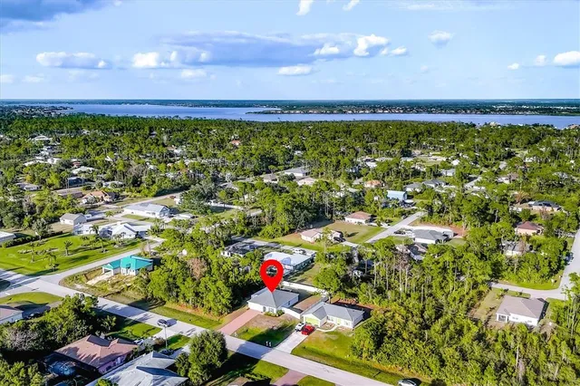 a view of a swimming pool with an outdoor seating