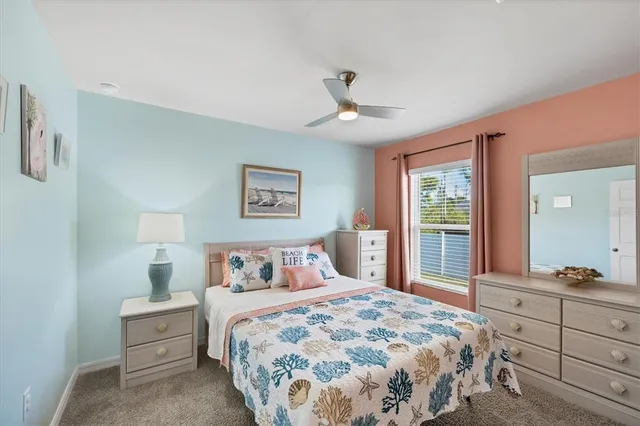 a bedroom with a large bed and a window