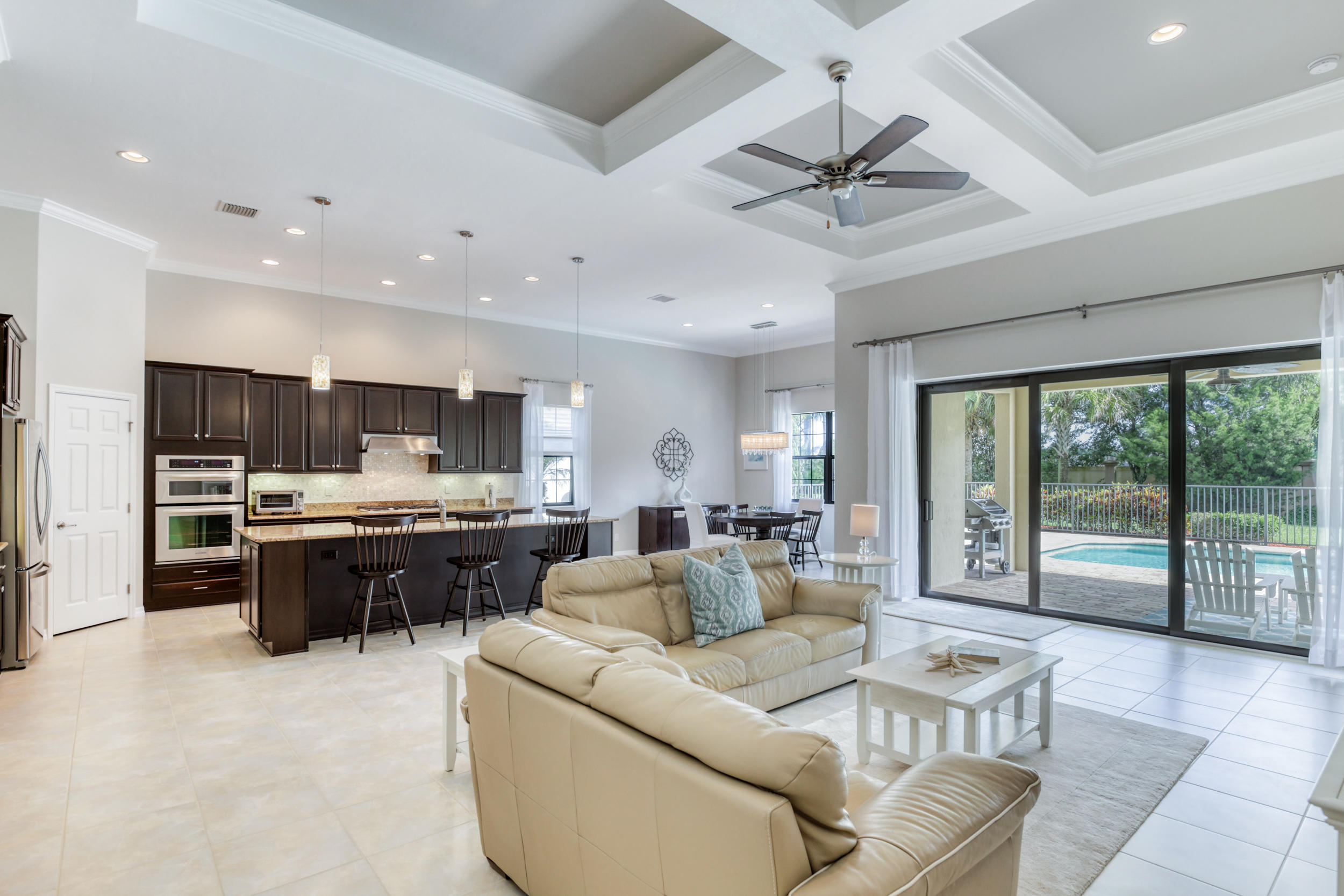 10375 Pisa Road Wellington, FL 33414 - Photo 10 of 79 kitchen and slider to patio