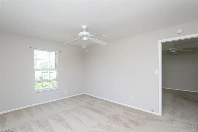 a view of washer and dryer with kitchen view