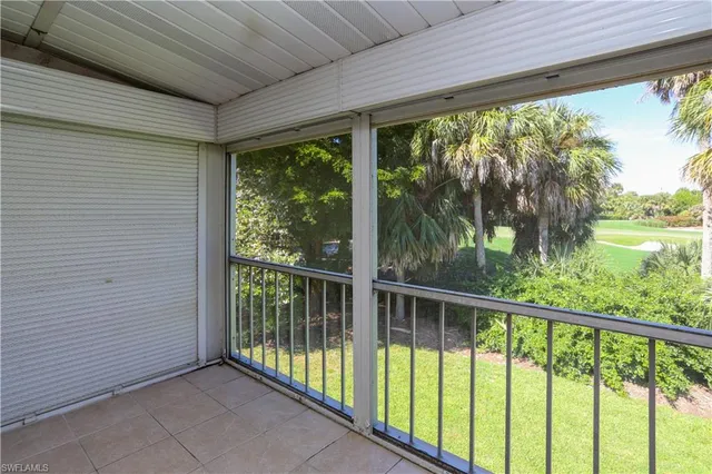a view of a house with a yard and a garage