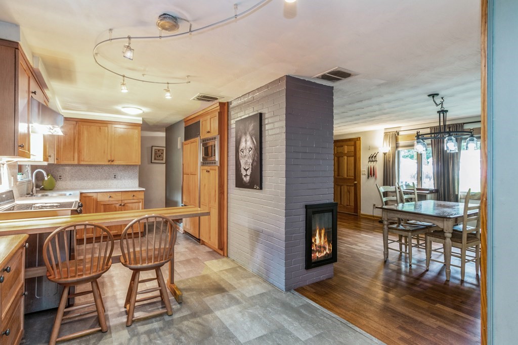 96 Simpson Drive Framingham, MA 01701 - Photo 11 of 35 a view of a dining room with furniture and wooden floor