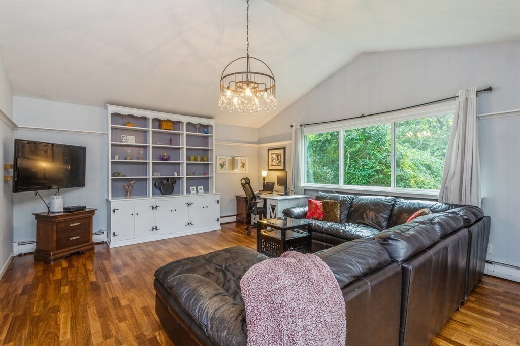 96 Simpson Drive Framingham, MA 01701 - Photo 18 of 35 a living room with furniture and a flat screen tv