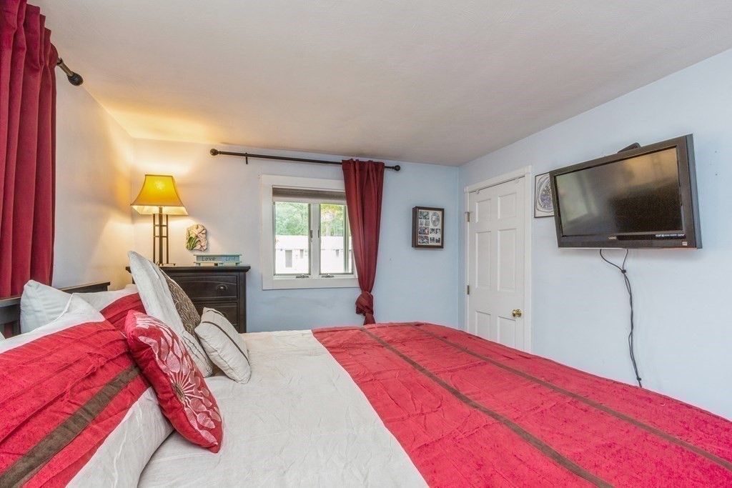 96 Simpson Drive Framingham, MA 01701 - Photo 25 of 35 a bedroom with a bed and a flat screen tv