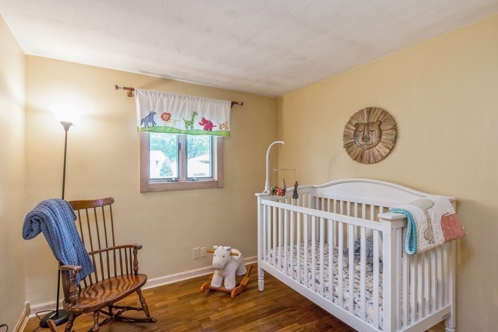 96 Simpson Drive Framingham, MA 01701 - Photo 26 of 35 a view of a room with furniture and wooden floor