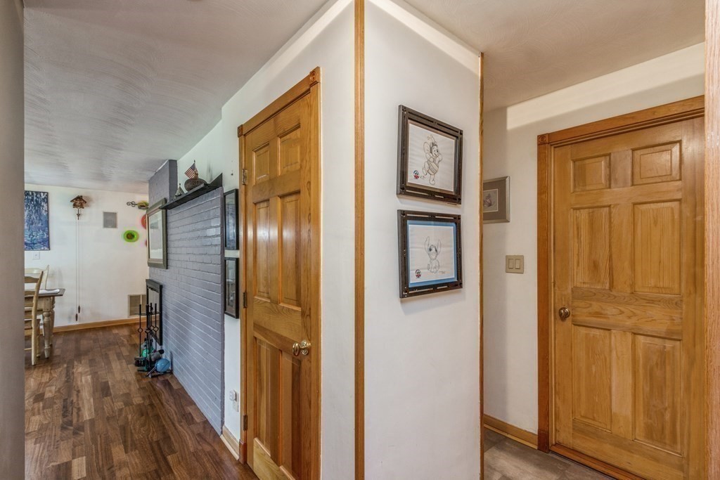 96 Simpson Drive Framingham, MA 01701 - Photo 28 of 35 a view of a livingroom with wooden floor and a bathroom