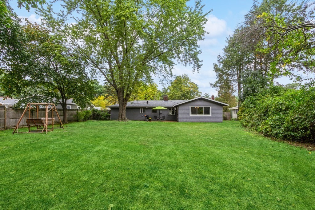 96 Simpson Drive Framingham, MA 01701 - Photo 31 of 35 a view of a tree in front of a house with a yard