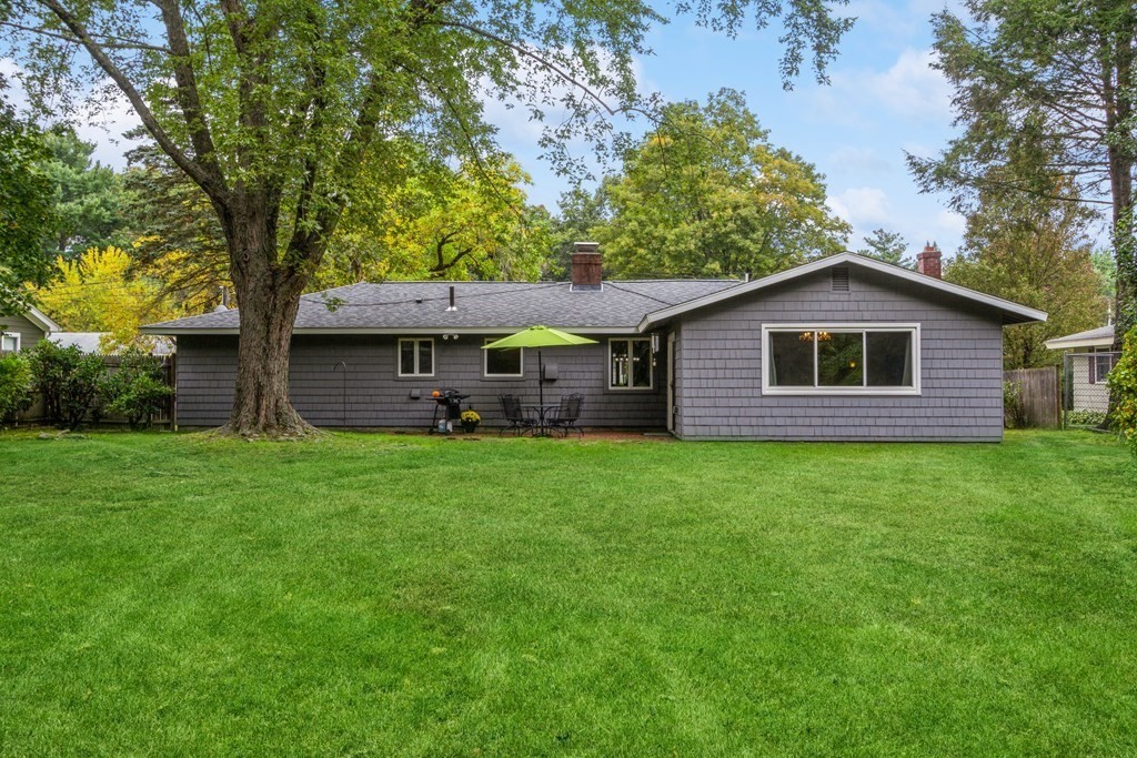 96 Simpson Drive Framingham, MA 01701 - Photo 32 of 35 a front view of a house with a garden