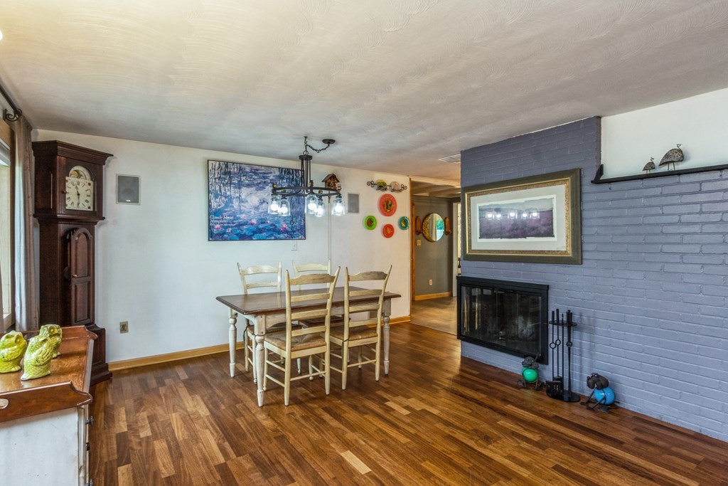 96 Simpson Drive Framingham, MA 01701 - Photo 6 of 35 a view of a livingroom with furniture and a fireplace