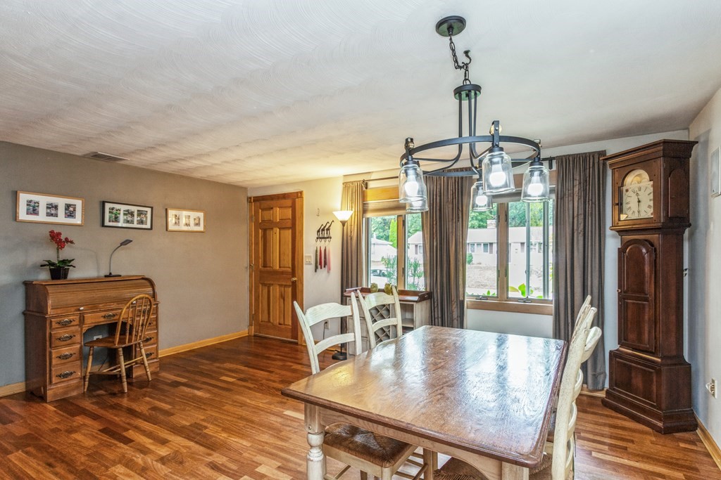 96 Simpson Drive Framingham, MA 01701 - Photo 9 of 35 a view of a dining room with furniture window and wooden floor