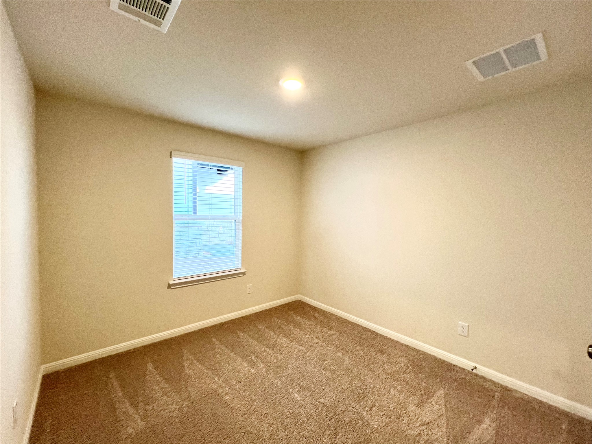 325 Alcatraz Loop Jarrell, TX 76537 - Photo 8 of 16 Carpeted spare room with baseboards