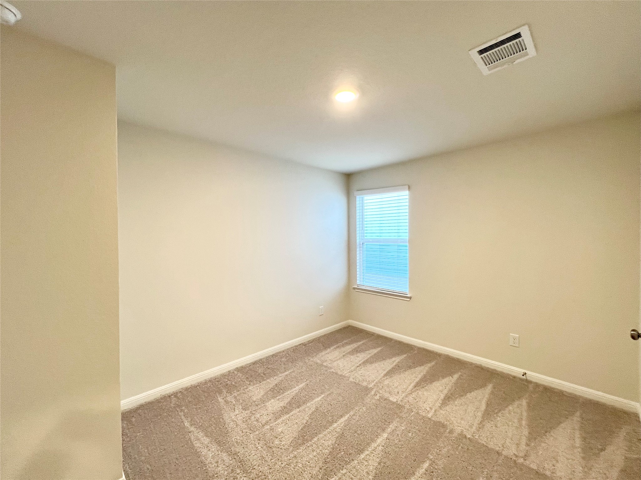 325 Alcatraz Loop Jarrell, TX 76537 - Photo 9 of 16 Carpeted spare room with baseboards