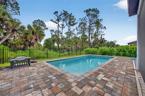 a view of swimming pool with a patio