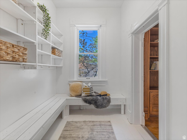 12825 South Fort Street Draper, UT 84020 - Photo 16 of 52 Entryway featuring built-in shelving, white wood-finish flooring, a built-in bench, and a window with trim
