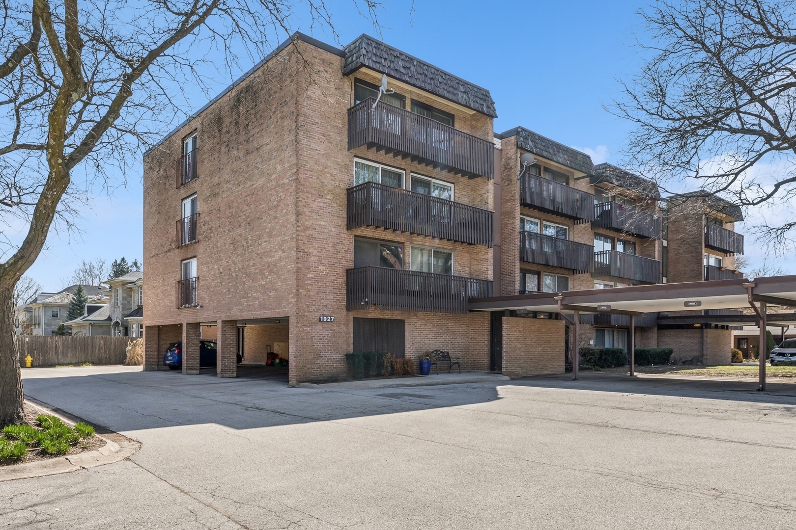 1927 Tanglewood Drive, Unit 4A Glenview, IL 60025 - Photo 1 of 16 a view of a building with a street