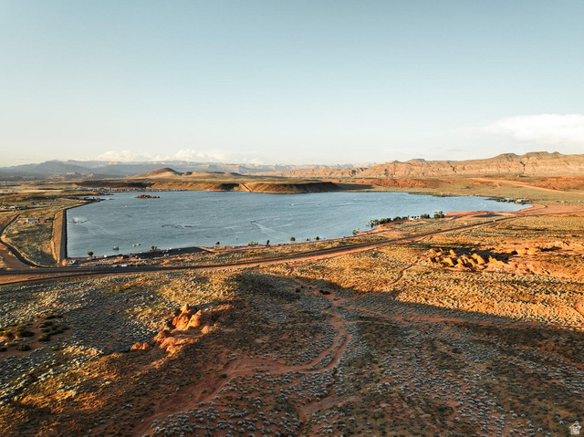 1693 Devils Gdn Lane Washington, UT 84780 - Photo 62 of 64 Expansive body of water with surrounding arid landscape featuring rolling hills and distant mountains