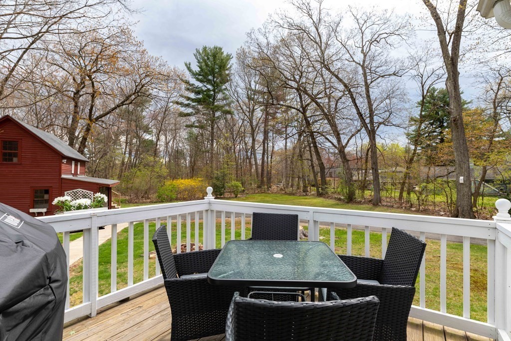 603 Spring Street Northampton, MA 01053 - Photo 11 of 38 a view of a patio with table and chairs and wooden floor