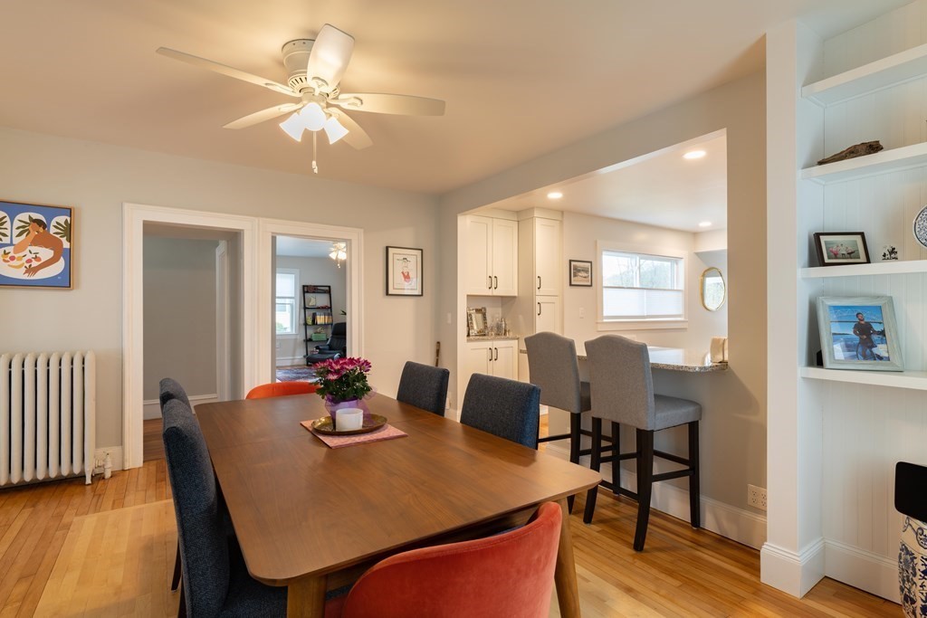 603 Spring Street Northampton, MA 01053 - Photo 16 of 38 a dining room with furniture a chandelier and wooden floor