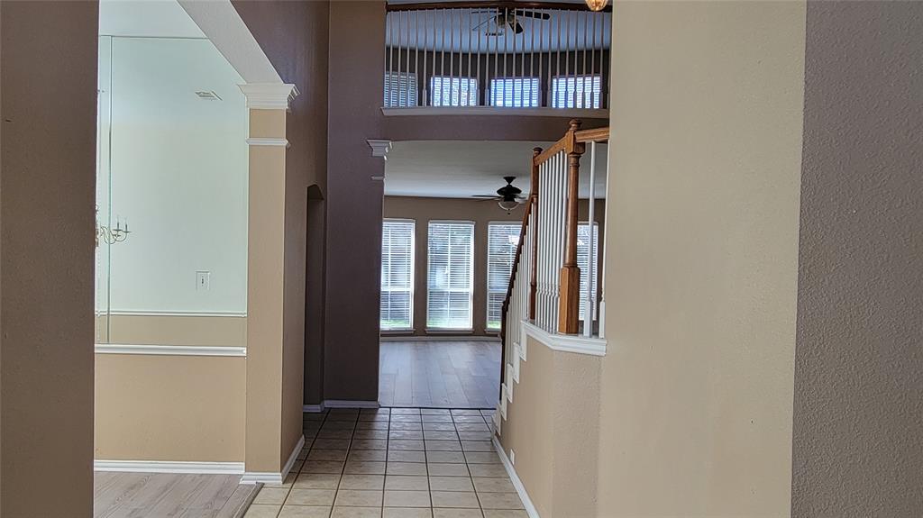 2400 Spillway Circle Frisco, TX 75036 - Photo 4 of 21 a view of a hallway with a door and wooden floor