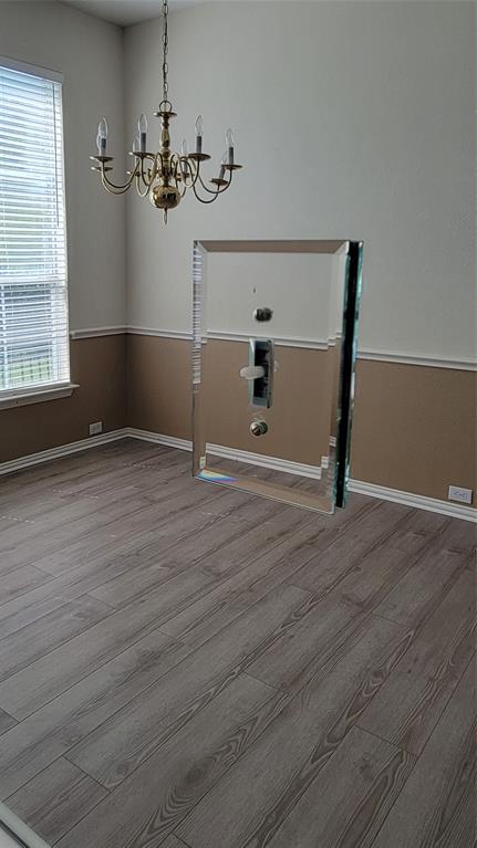 2400 Spillway Circle Frisco, TX 75036 - Photo 7 of 21 a view of a room with wooden floor and staircase